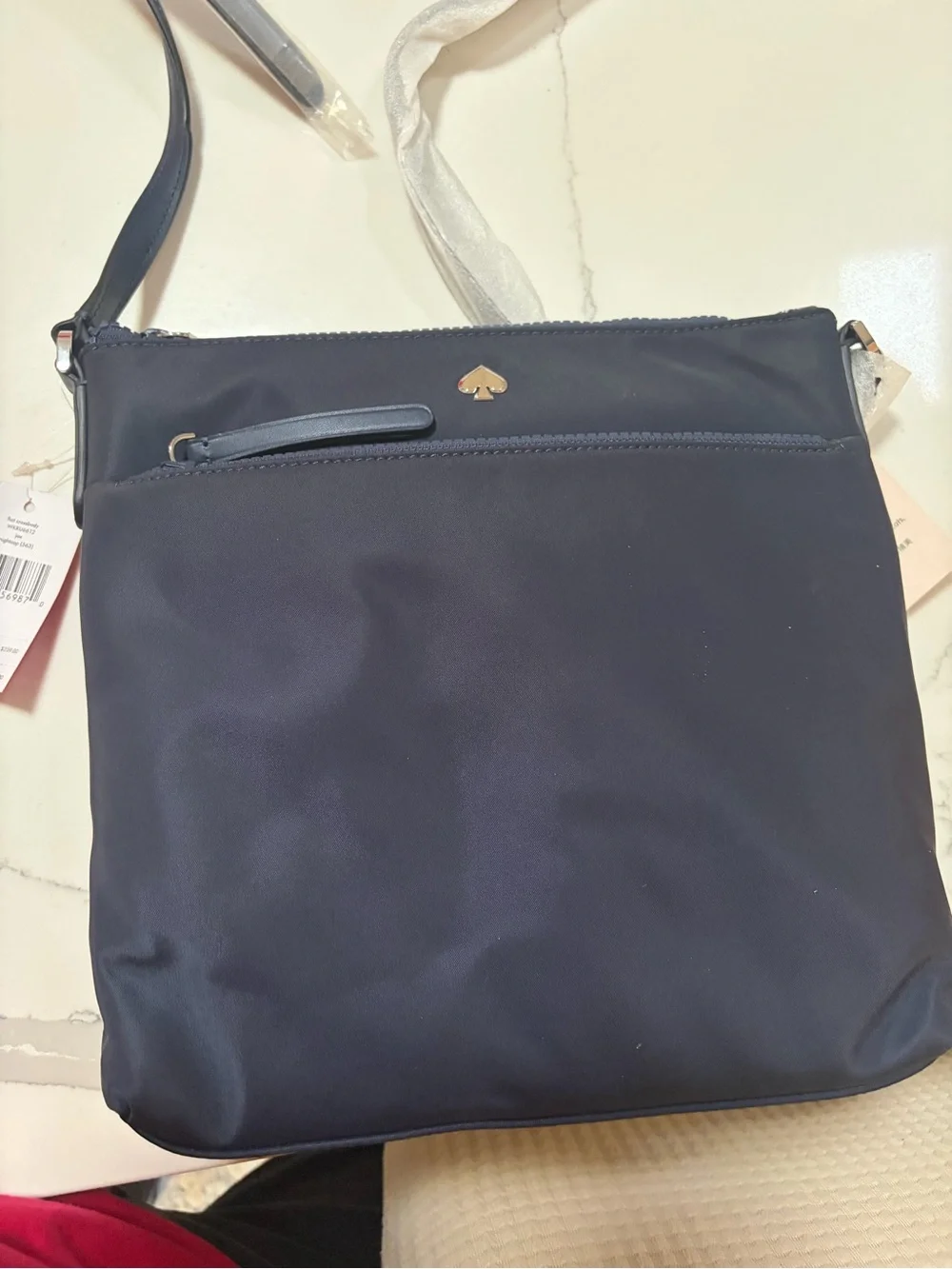 kate spade navy blue nylon crossbody with gold logo